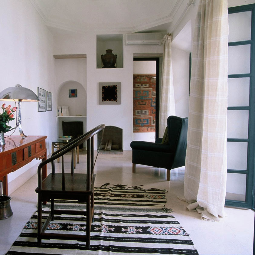 Spacious bedroom with writing desk and fire place